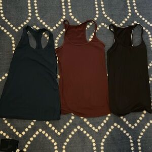 Three Lululemon racer back tops size 4 good condition